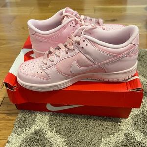 All pink dunks in a 6y. Will fit a woman’s 7.5. Brand new still in box
